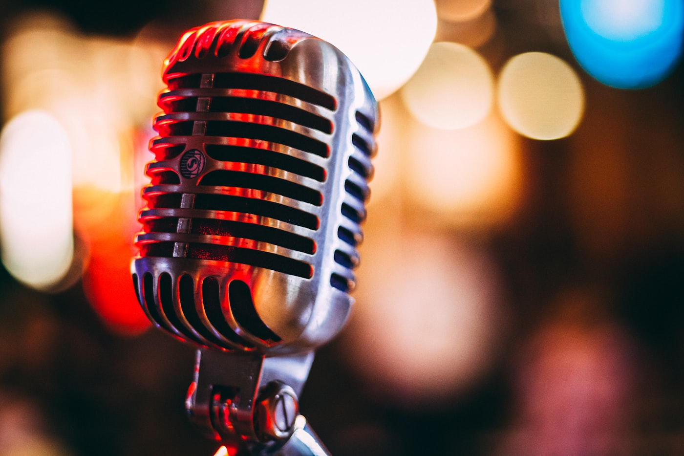 A vintage microphone in dark stage light